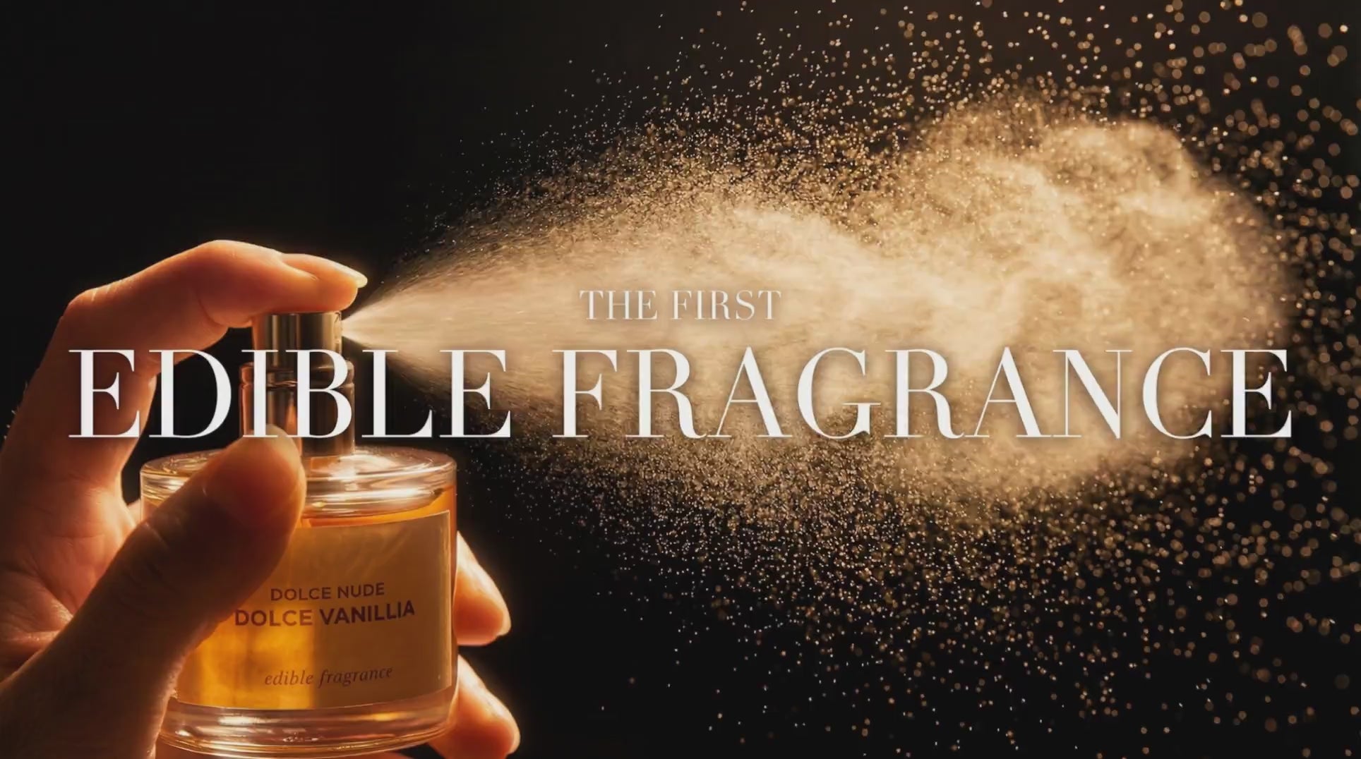 動画を読み込む: DOLCE NUDE Vanillia Dolce edible fragrance bottle held in hand with golden sparkle particles floating on dark background, text reads the first edible fragrance